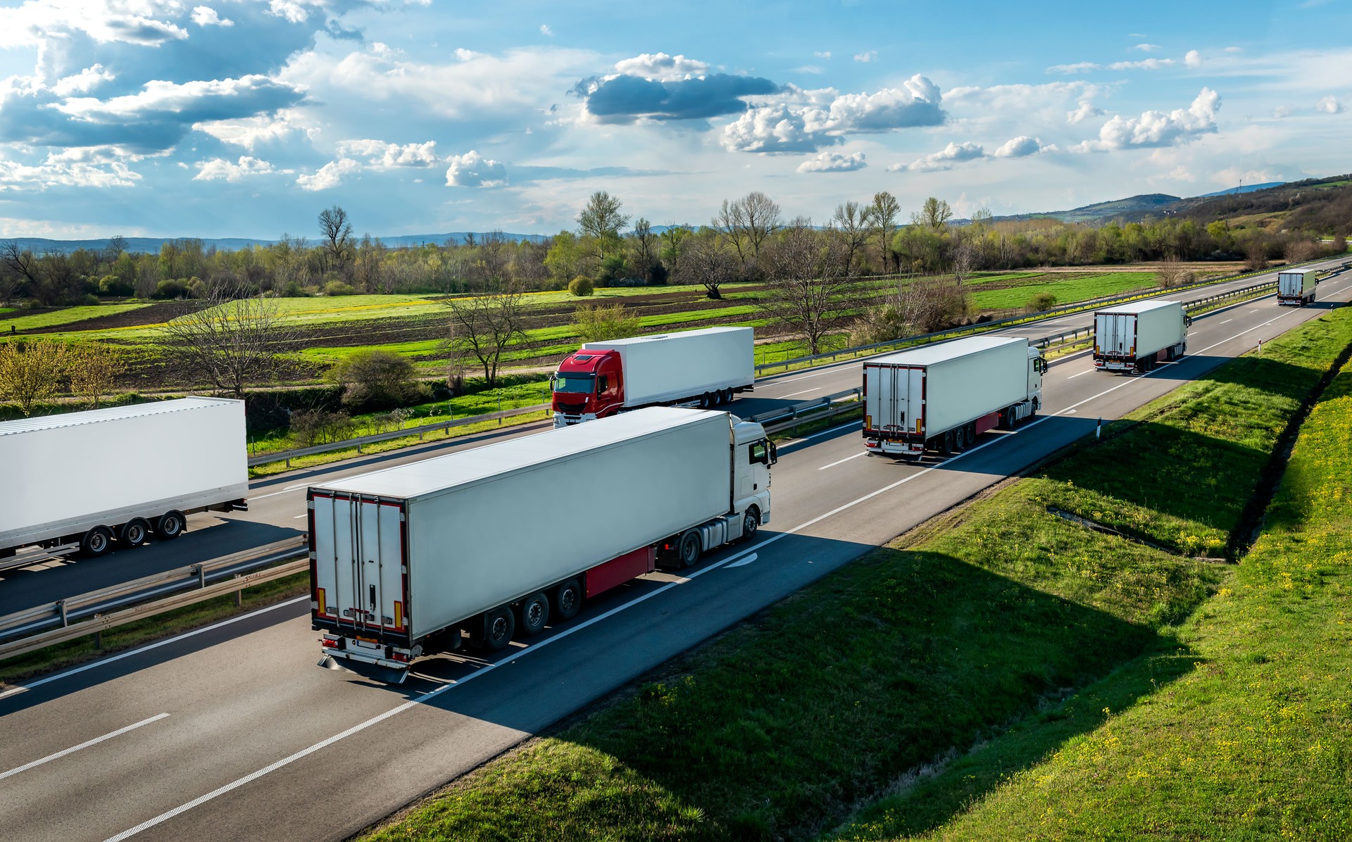 Transportation Trucks in lines passing